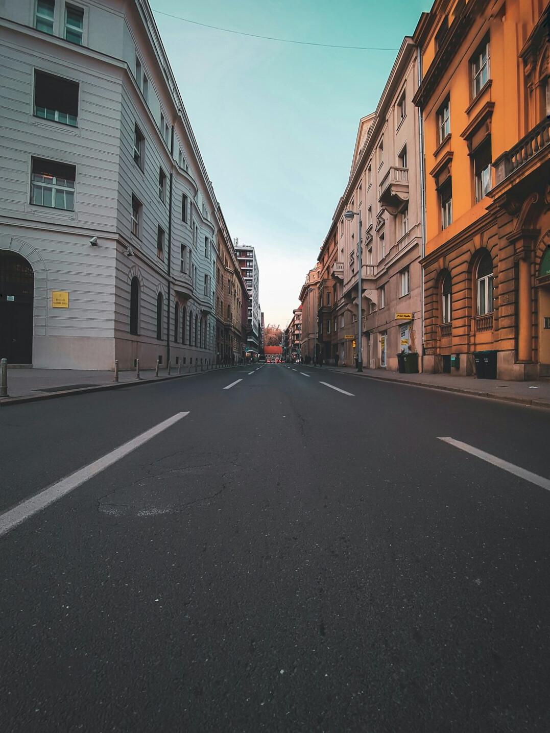Quiet European city street in early morning light