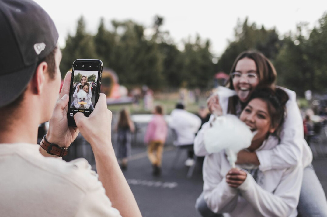 group of friends taking photos