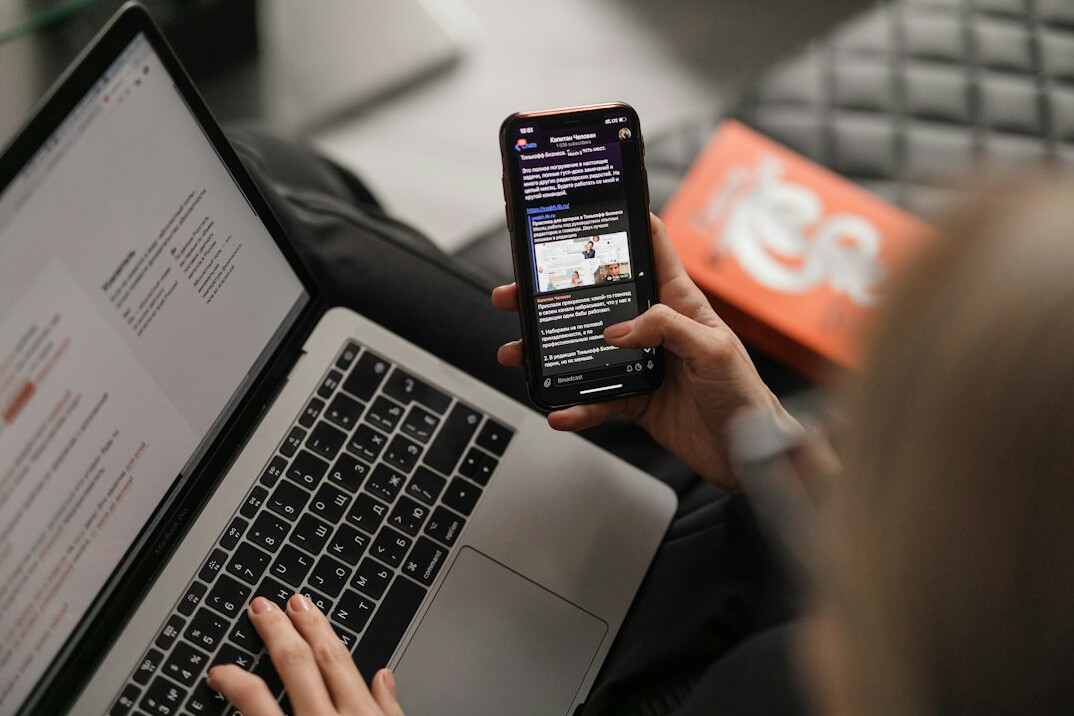 woman checking social media on phone